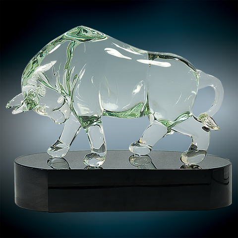 clear crystal bull on a black glass base