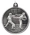 silver karate medal in a classic High Relief style